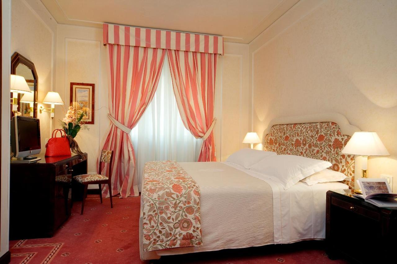 Hotel De La Ville Флоренция Номер фото